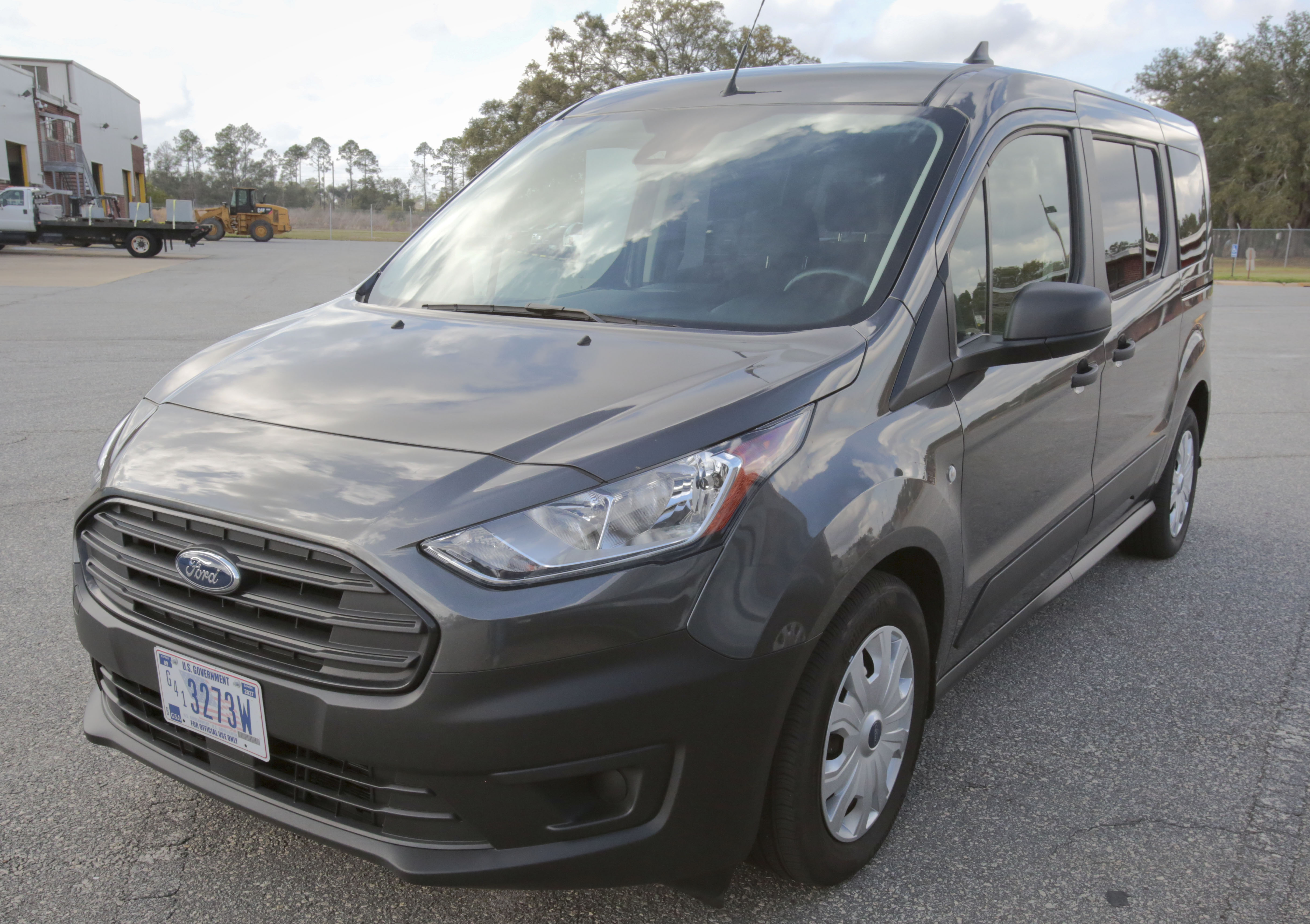 A black Ford Fiesta parked in a parking lot.